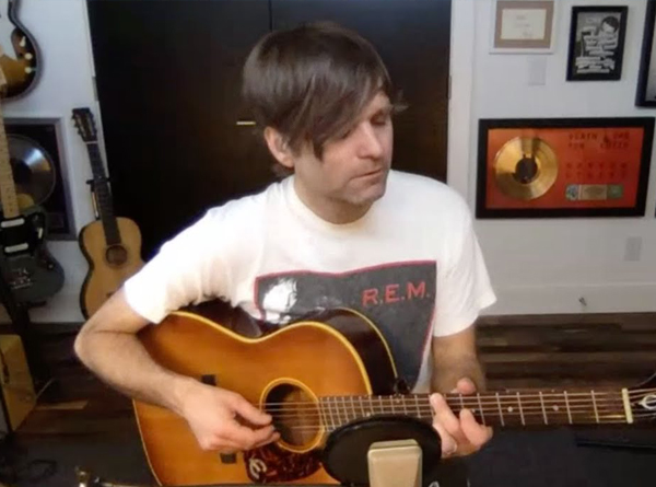 Picture of Ben Gibbard with a guitar in his home