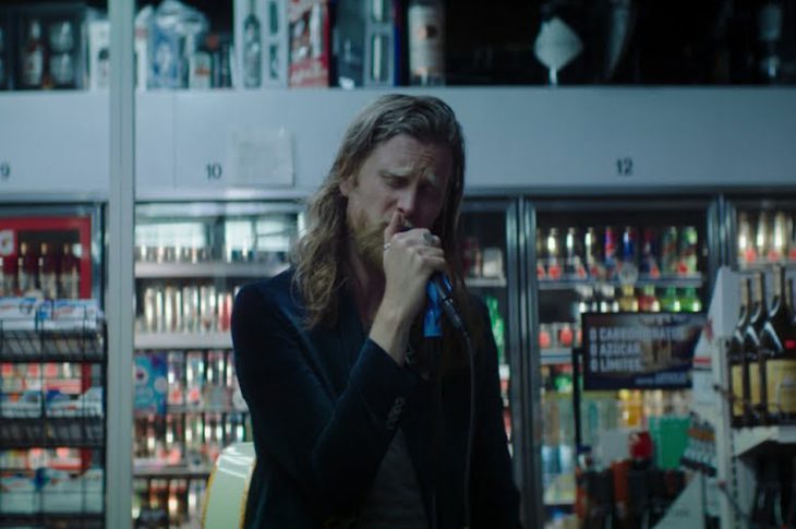 The Lumineers frontman Wesley Schultz singing in a convenience store